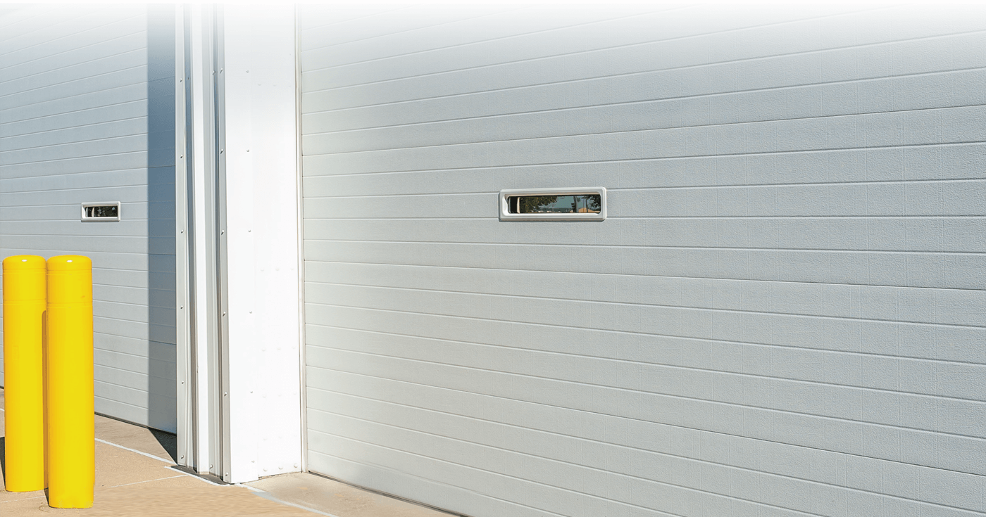 A S.E. Saskatchewan Commercial Building with a Upwardor® Commercial Overhead Door - Banner