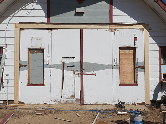 An Old Agricultural Building with Wooden Doors