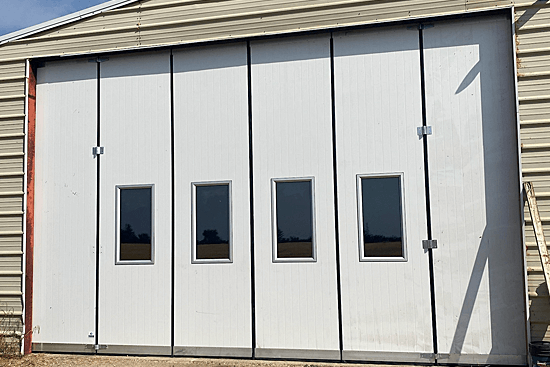A Large Farm Building with FINDOOR Doors
