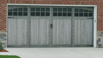 Wood Overlay Carriage shown in design 31A, cedar, field stained with optional wrought iron handles.