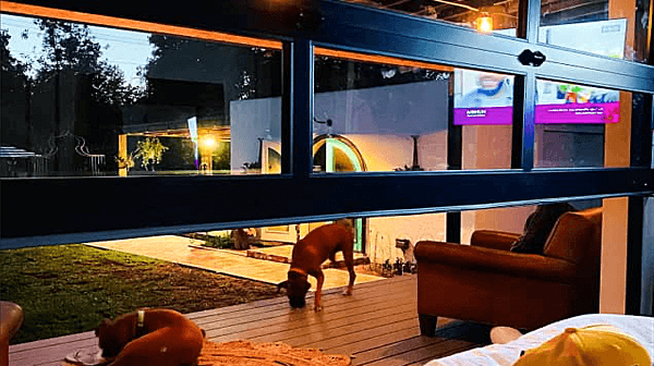 Full View of CHI® Aluminum Garage Door Looking Out to the Yard.